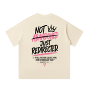 Back of mild apricot Not Abandoned Just Redirected oversized tee with Hebrews 13:5 statement print