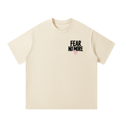 Front of mild apricot God Delivered Me oversized tee with Fear No More left chest print